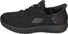A side view of a black Skechers slip-on shoe. Voir les images du produit