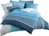 A neatly folded bedding set with a striped pattern in various shades of blue. Produktbild-Vorschau