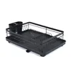 A black metal dish drying rack with an attached utensil holder and a drip tray sits on a white background. Produktbild-Vorschau