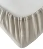 A close-up view of the corner of a fitted sheet, showing the elasticized edge. Produktbild-Vorschau