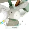 A close-up of a baby toy, a plush donkey with a rattle. Produktbild-Vorschau