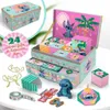 A Lilo & Stitch themed advent calendar keepsake box is open, displaying its contents and surrounding items. Náhled obrázku produktu