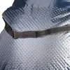 A close-up of a blue Schlupfsack with a textured surface and a black strap with velcro. Náhled obrázku produktu