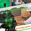 A person is tiling a wall with the help of a laser level. Podgląd zdjęcia produktu