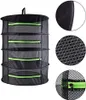 A black drying rack with green zippers is shown against a white background. Close-up views of the mesh material and a zipper are provided on the right side. Produktbild-Vorschau