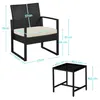A black rattan armchair and a black glass-topped side table with dimensions indicated by measurement lines and text. Podgląd zdjęcia produktu