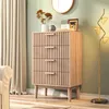 A chest of drawers with decorative elements in a room setting. Anteprima dell’immagine prodotto
