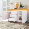 A modern white sideboard with a wooden top and LED lighting, shown in a room with a rug and a window. Voir les images du produit