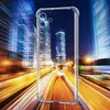 A transparent phone case is superimposed over a blurred, motion-streaked image of a city at night with car lights. Produktbild-Vorschau