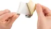Hands peeling off the protective backing from an adhesive strip on a bathroom squeegee holder. Produktbild-Vorschau