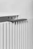 A close-up of a white cabinet with a black handle. Produktbild-Vorschau