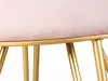 Close-up of the top part of a stool, showing the pink velvet seat and gold metal legs. Produktbild-Vorschau