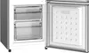 An open refrigerator with two clear drawers visible on the left and the interior of the freezer door on the right. Produktbild-Vorschau