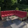 An outdoor seating area with a pallet sofa and coffee table. Produktbild-Vorschau