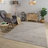 A living room scene with a chair, lamp, side table, cabinet, plant, and rug. Produktbild-Vorschau