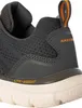 A close-up view of the heel and side of a grey SKECHERS shoe. Produktbild-Vorschau