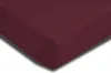 A close-up view of a burgundy fitted sheet, showing the corner and texture. Produktbild-Vorschau
