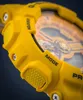 Close-up view of a yellow G-Shock watch, focusing on the side buttons and part of the watch face. Produktbild-Vorschau