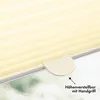 A close-up view of a cream-colored pleated blind with a height adjustment handle. Produktbild-Vorschau