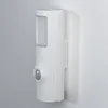 A white motion sensor light mounted on a textured wall. Produktbild-Vorschau