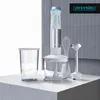 A hand blender set with accessories displayed on a countertop against a tiled wall. Produktbild-Vorschau