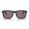 A pair of black Oakley Holbrook sunglasses with purple lenses, presented on a white background. Náhled obrázku produktu