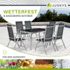 A patio furniture set with a table and chairs on a tiled patio, with trees and sky in the background. The image also includes seasonal imagery at the bottom. Produktbild-Vorschau
