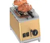 A gold toaster with two croissants on top, against a white background. Podgląd zdjęcia produktu