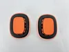 Two orange ear pads with black trim are laid out on a white background. Produktbild-Vorschau
