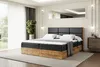 A bedroom scene with a bed, nightstand, and window.