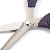 A close-up view of a pair of scissors, focusing on the pivot and blades. Produktbild-Vorschau
