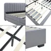 A collage of four close-up images of a gray upholstered bed frame, showing different angles and details of its construction. Produktbild-Vorschau