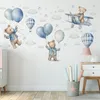 A nursery or child's room wall decorated with watercolor-style wall stickers of teddy bears, balloons, clouds, and stars. Anteprima dell’immagine prodotto