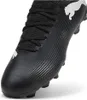 A close-up view of a black Puma soccer cleat. Podgląd zdjęcia produktu