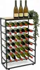 A metal wine rack filled with wine bottles, with a plant on top. Anteprima dell’immagine prodotto