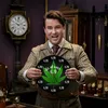 A man in a vintage suit holds up a clock with a cannabis leaf design. Produktbild-Vorschau