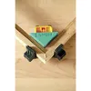 A corner clamp tool is shown holding two pieces of wood together at a 90-degree angle. Produktbild-Vorschau