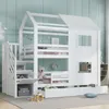A white bunk bed shaped like a house with stairs and storage compartments, set in a child's bedroom. Produktbild-Vorschau