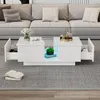 A modern living room with a white high-gloss coffee table in front of a gray sofa. Produktbild-Vorschau