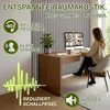 A woman is working at a desk in a room with acoustic wall panels. Náhled obrázku produktu