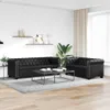 A living room setting with two black leather sofas and a coffee table. Produktbild-Vorschau
