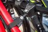 A close-up view of a bicycle rack attachment, showing straps and metal components. Anteprima dell’immagine prodotto