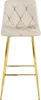 A beige velvet bar stool with gold legs against a white background. Voir les images du produit