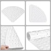 A collage of four images showing a white triangular shower mat from different angles and perspectives. Voir les images du produit
