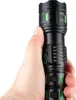 A hand holding a black flashlight with green accents. Produktbild-Vorschau