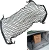 A black cargo net for a car trunk, shown both flat and installed in a trunk with a box. Voir les images du produit