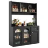 A black kitchen buffet cabinet with glass doors and a drawer, filled with various items. Produktbild-Vorschau