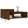 A brown wooden coffee table with storage compartments and a vase with a plant on top. Anteprima dell’immagine prodotto