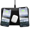 A black wireless charging pad with two smartphones and a pair of wireless earbuds on it. Voir les images du produit