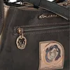 A close-up view of a handbag's details, including a zipper, a charm, and a decorative patch. Anteprima dell’immagine prodotto